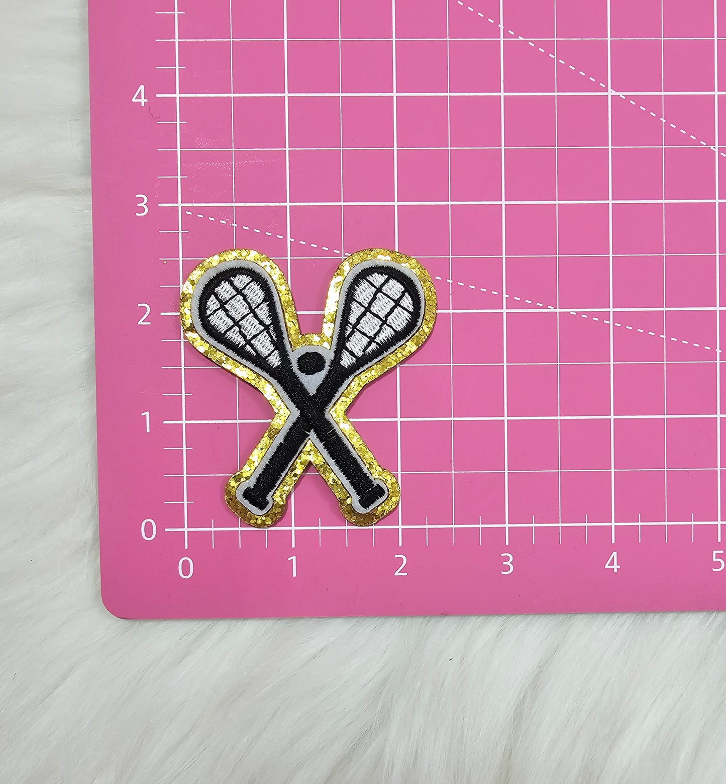 Lacross Cross Sticks with Ball on Gold Glitter Iron On Patch